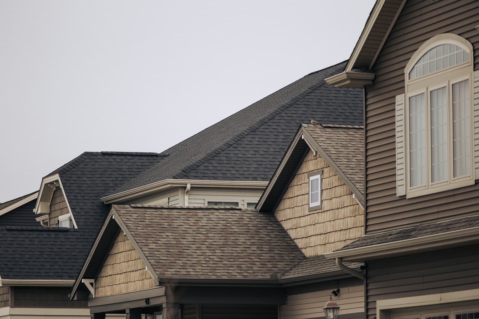 A row of houses with new shingles