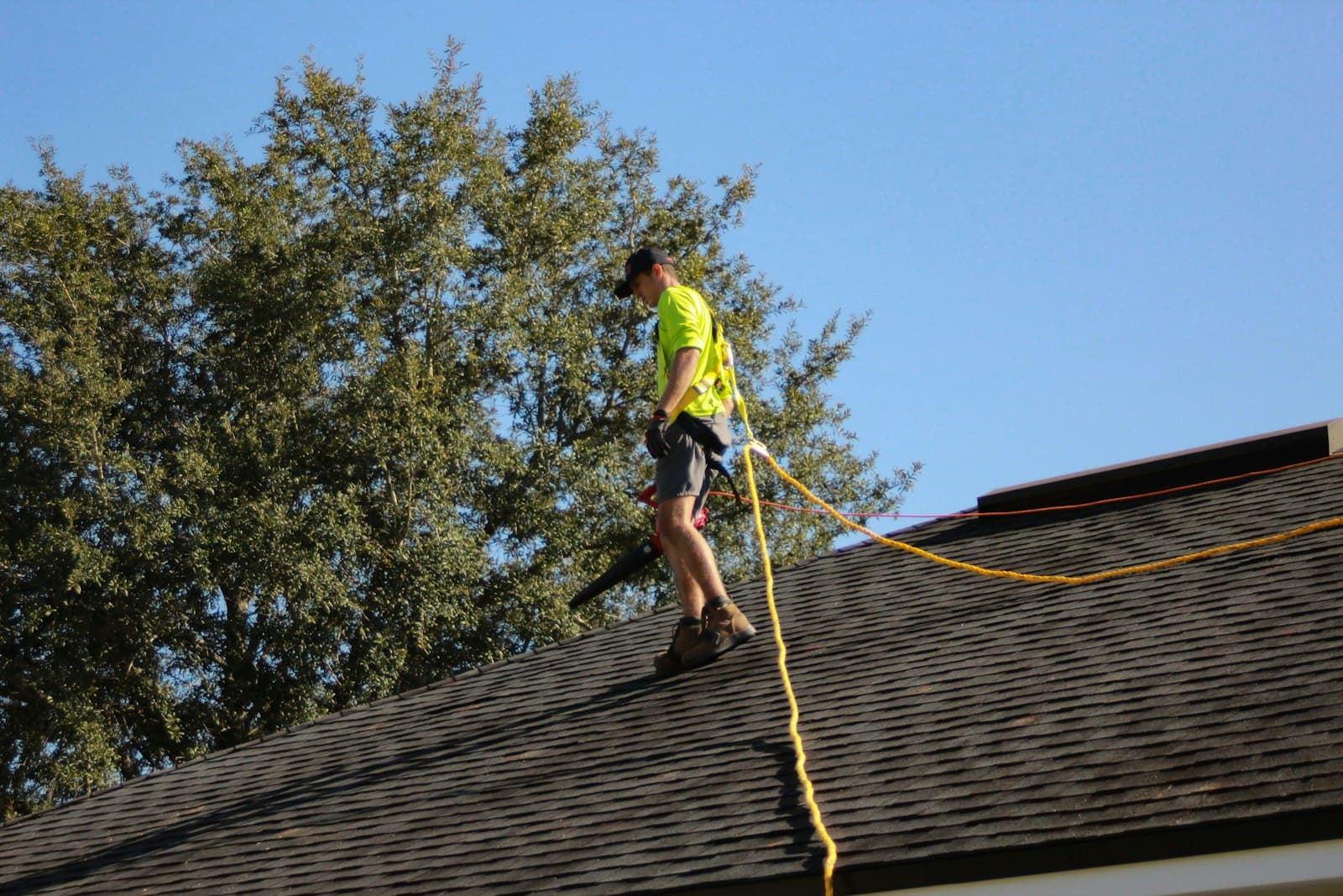 Roped-off work on a steep pitch